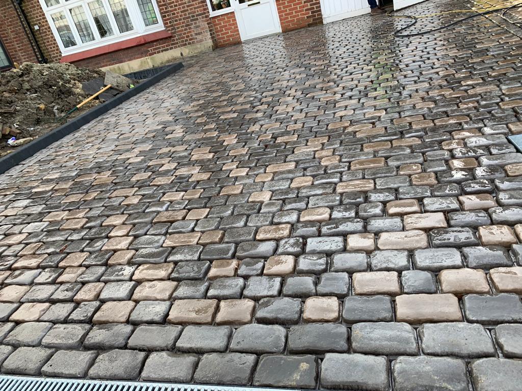 clean grey block paved driveway